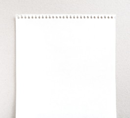 close up of a white note paper on white background