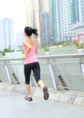 healthy lifestyle woman running at city