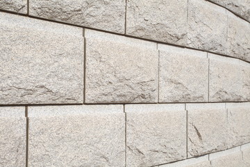 Obraz premium background of natural brown stone block wall