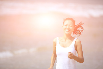 Fototapeta na wymiar fitness woman running at beach