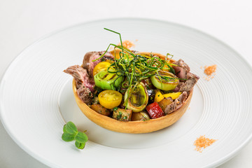 Warm meat salad with grilled vegetables