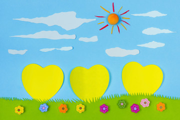 Fototapeta na wymiar Children's play: yellow harts on blue sky