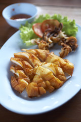 squid grill and spacy sauce on table