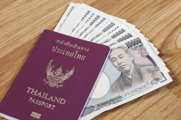 Japanese banknotes and Thailand passport