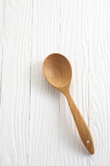 wooden spoon on white table