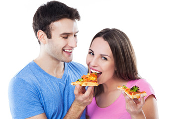 Young couple eating pizza