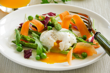 Summer salad with poached egg.