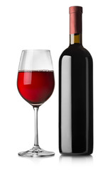 Glass and black bottle of red wine
