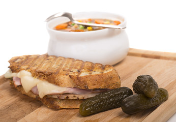 Delicious ham, pork and swiss cheese panini with vegetable soup