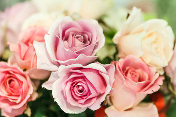 Fototapeta na wymiar pink artificial roses close up