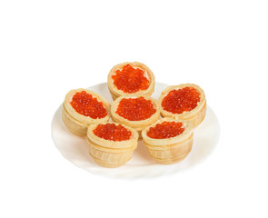 Red caviar in tartlets. Isolated