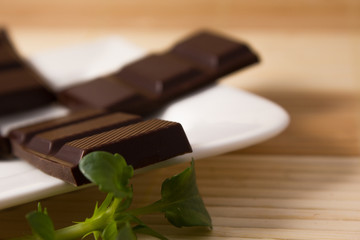 four dark chocolate bars close
