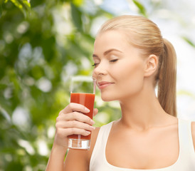 young woman drinking tomato juice