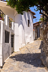 Narrow street in greek mountain village, island of Crete