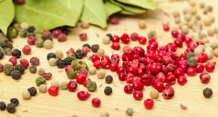 Dry bay laurel leaf with multicolored peppercorn