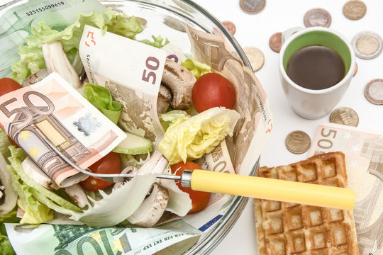 lettuce and cerry salad with Euro banknotes in it