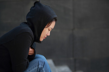 Lonely woman sitting on the stairs 