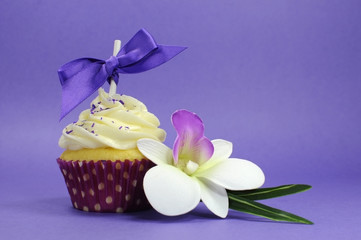 Purple theme cupcake with orchid flower