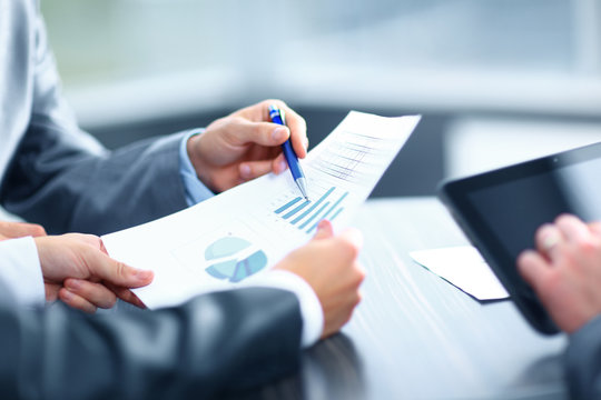 Businessman holding digital tablet at meeting