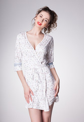 Fototapeta premium beautiful woman wearing pajamas - studio shot on grey