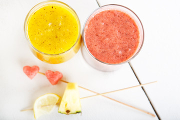 Fresh organic red and yellow smoothie with apple, watermelon, po