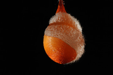 Orange balloon with water exploded