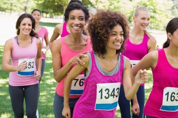 Fototapeta na wymiar Participants of breast cancer marathon running