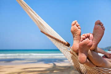 couple in hammock on the beach