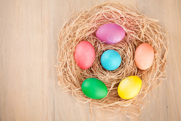 colorful easter eggs on a wooden background