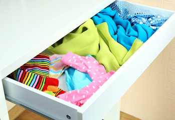Open drawer with clothes close up