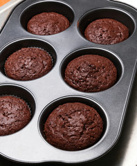 Chocolate muffins in a baking tin