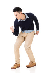 Naklejka premium Excited Asian young man