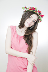 Young beautiful woman with flower wreath on head