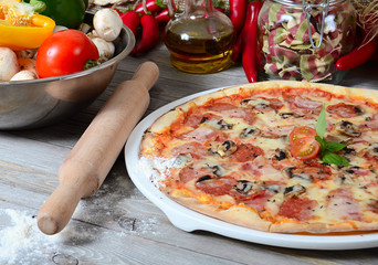 The Italian pizza with olives and a salami