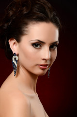 The beautiful woman in jewelry earrings