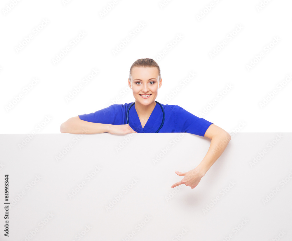 Wall mural A professional and cheerful female doctor with a white banner