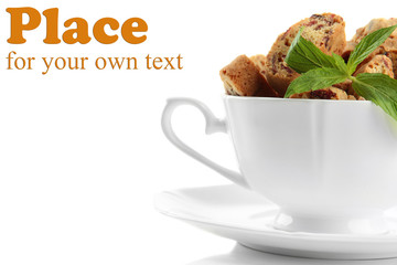 Tasty cookies in cup isolated on white