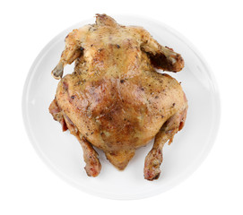 Whole roasted chicken on plate, isolated on white