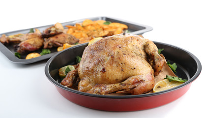 Woman holding pan with  homemade fried chicken  and vegetables