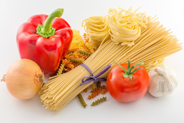 Pasta spaghetti, vegetables and spices, isolated on white