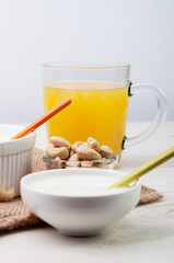 Bowls with white cream and a cup of juice