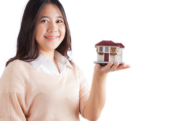 Woman holding little house