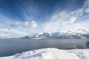 Arctic Norway, fjord surrounded by snowy mountains