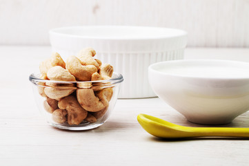 Three bowls and a yellow spoon