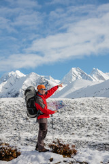 Hiker posing in Himalayas in front of big mountains