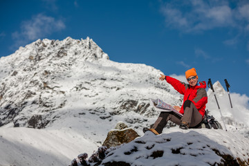 Hiker posing in Himalayas in front of big mountains