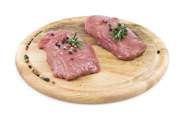 raw meat with rosemary