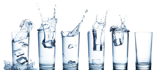 water splash in glasses isolated on white