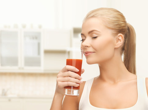 Young Woman Drinking Tomato Juice