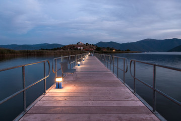 Floating bridge at sunset in Mikri Prespa Lake, Greece